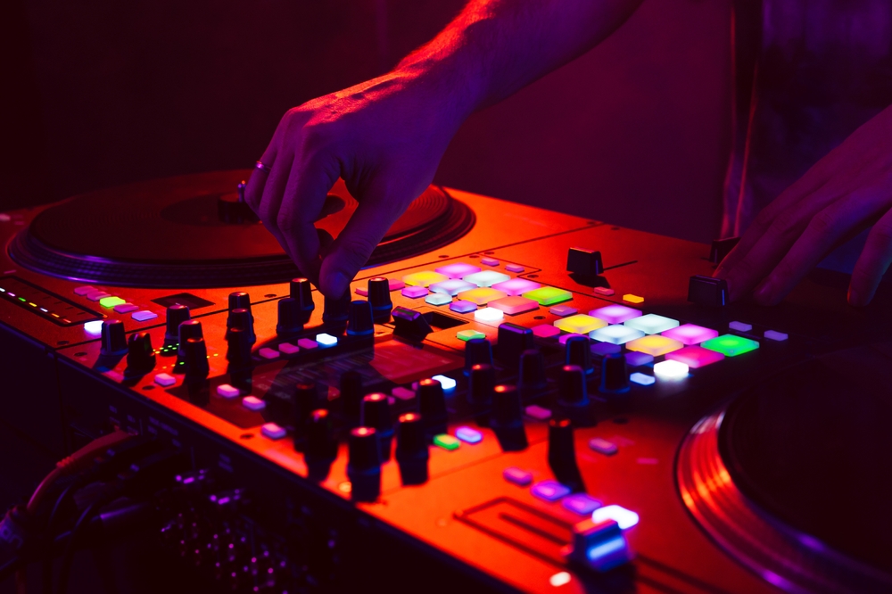 Close,Up,Of,Dj,Hands,On,Dj,Console,Mixer,During